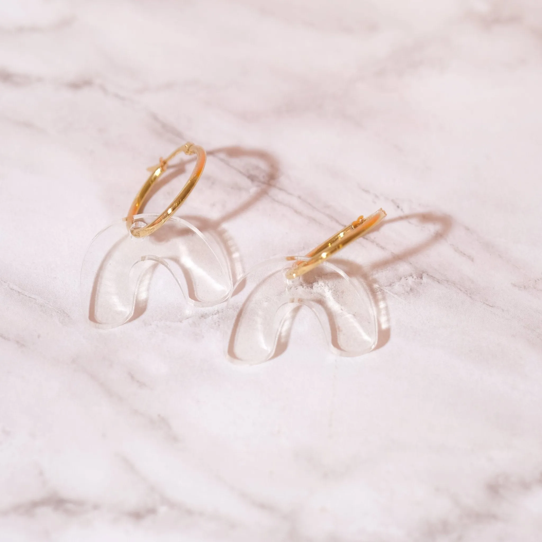 Clear arch hoop earrings